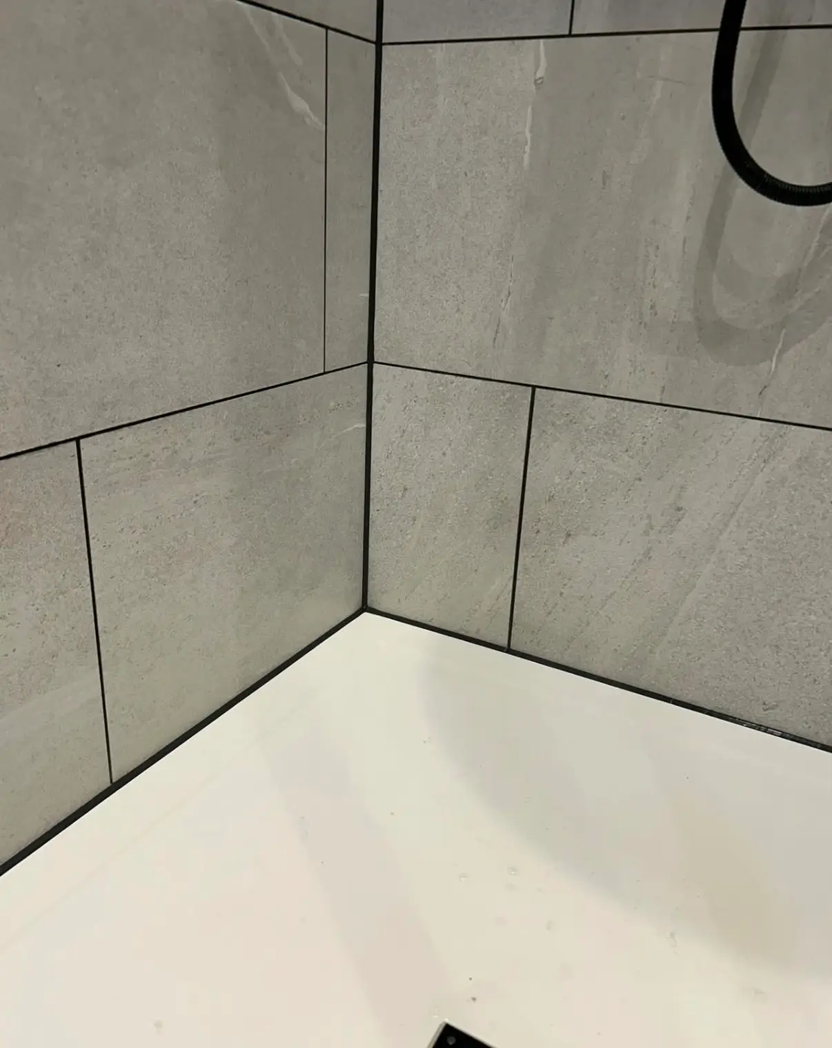 Tiled bathroom and shower tray ready for a clean sealant finish